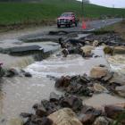 A North Otago farmer takes feed to stock along the Weston-Ngapara Rd, near Windsor Park yesterday...