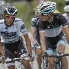 Alberto Contador of Spain, left, and Andy Schleck of Luxembourg talk as they climb Galibier pass...