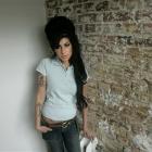 Amy Winehouse poses for photographs after being interviewed by The Associated Press at a studio...