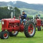 Scottie Birse, of Tapanui, leads a group of vintage Farmall tractors.