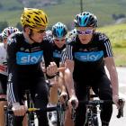 Bradley Wiggins of Britain (left) cycles with teammate and compatriot Christopher Froome during a...