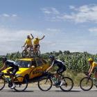 Bradley Wiggins (right) of Britain cycles past spectators during the 12th stage of the 99th Tour...