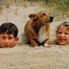 Britain's Prince Charles and Princess Anne play in the sand at Holkham Beach in this photograph...