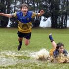 But Tim O'Connor-Varcoe (11) and Christian Henderson (13) get wet and have fun anyway yesterday...