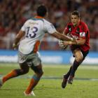 Dan Carter of the Crusaders runs at Robert Ebersohn of the Cheetahs during their Super 15 match...