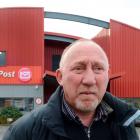 Engineering, Printing and Manufacturing Union organiser Mike Kirwood in front of the Dunedin mail...