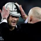 Former All Black captain Jock Hobbs places a 100th test cap on current captain Richie McCaw after...