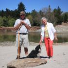 Hugh Clarke, his dog Jessie, and Ingrid Mueller, inspect a refreshed Aronui Dam on Thursday....