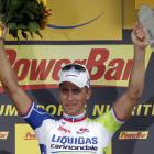 Liquigas-Cannondale rider Peter Sagan celebrates on the podium after winning the first stage of...