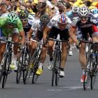 Lotto-Belisol Team rider Andre Greipel of Germany sprints ahead of Liquigas-Cannondale rider...