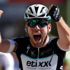 Mark Cavendish celebrates as he crosses the finish line to win the 190.5km 7th stage, from...