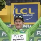 Mark Cavendish of Britain, wearing the top sprinter's green jersey, celebrates on the podium of...