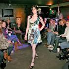 Model Gabrielle Coppola shows a dress from Nine at the charity fashion show at Subculture last...