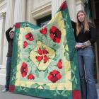 North Otago Museum registrar Morgan Bennet (left) and museum curator Chloe Searle show off the...