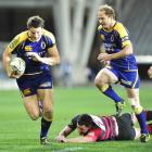 Otago fullback Glenn Dickson (left) goes on the charge against Canterbury at Forsyth Barr Stadium...