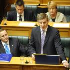 Prime Minister John Key (left) listens as Finance Minister Bill English delivers the Budget...