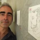 Queenstown artist Toby Eglesfield poses with one of the strangers captured in  sketches he made...