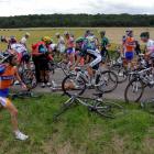 Riders are seen after a fall during the sixth stage of the 99th Tour de France between Epernay...
