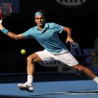 Roger Federer of Switzerland returns to Nikolay Davydenko of Russia in their Men's singles...