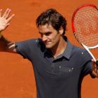 Roger Federer of Switzerland waves after winning his match against Tobias Kamke of Germany at the...