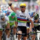 Sky Procycling rider Mark Cavendish of Britain celebrates winning the second stage of the 99th...