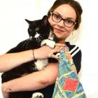 SPCA Otago animal manager Grace Hepburn  holds the cat that was dumped, in a tied pillowcase, on...