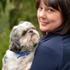 SPCA Otago business development manager Kirsty Thomson holds abandoned purebred shih tzu Ted....