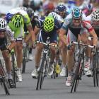 Stage winner Andre Greipel of Germany, foreground right, and second place Mark Cavendish of...