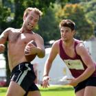 Students Callum Mulligan (19, left) and Simon Roberts (20), both of Christchurch, play a game of...