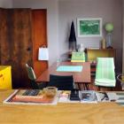 The dining area which is furnished with secondhand furniture.