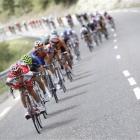 The pack speeds downhill during the 17th stage of the Tour de France from Gap, France to Pinerolo...