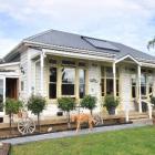 The villa was built in 1914 and the sunroom added on the side in 1930. Photos by Linda Robertson,...