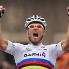 Thor Hushovd of Norway clenches his fists as he crosses the finish line to win the 13th stage of...