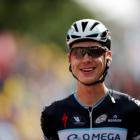 Tony Martin celebrates as he crosses the finish line to win the 170km ninth stage of the Tour de...