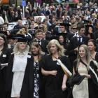 University of Otago graduands take part in an academic parade along Stuart St, Dunedin, before...