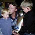 Otago Volts captain Craig Cumming greets sons Jacob and Zac at Dunedin Airport on Monday. Photo...