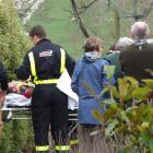 Volunteer fire crews, St John and police from Balclutha are pictured ferrying the man to the...