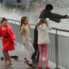 Winter holiday entertainment aplenty for these children during one of July's high tides at the St...