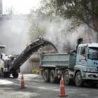 Contractors remove asphalt from Cumberland St by the University of Otago this week for the one...