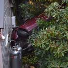 The victim’s car ploughed through shrubbery and over a retaining wall into a house on Greenock St...