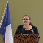 Christiane Leurquin speaks at a gathering after being awarded the French National Order of Merit...