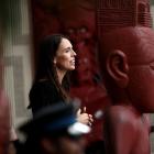 New Zealand Prime Minister Jacinda Ardern speaks on the veranda of Te Whare Runanga on the...