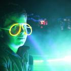 Jack Farrell, of Alexandra, glows among the surrounding lights at his festival on Saturday, which...