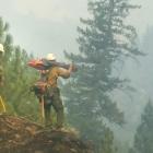 Firefighters at the Mendocino fire in Northern California take stock of where to create fire...