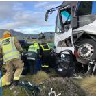 Emergency services staff work at the scene of a fatal collision near Kingston yesterday. Photo:...