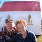 Mike and Rosemary Riddell in front of the tiny chapel on their Oturehua property. The couple are...