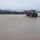 Kelso dairy farmer Adam McCall attends to stock stranded by the Pomahaka River during January's...