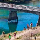 A group of people at the Albert Town bridge today. Photo: QLDC