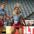 Steel defender Taneisha Fifita jostles for position with Magic shooter Kelsey McPhee during an...