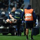 Highlanders lock Josh Dickson is taken off the field during a Super Rugby Aotearoa match against...